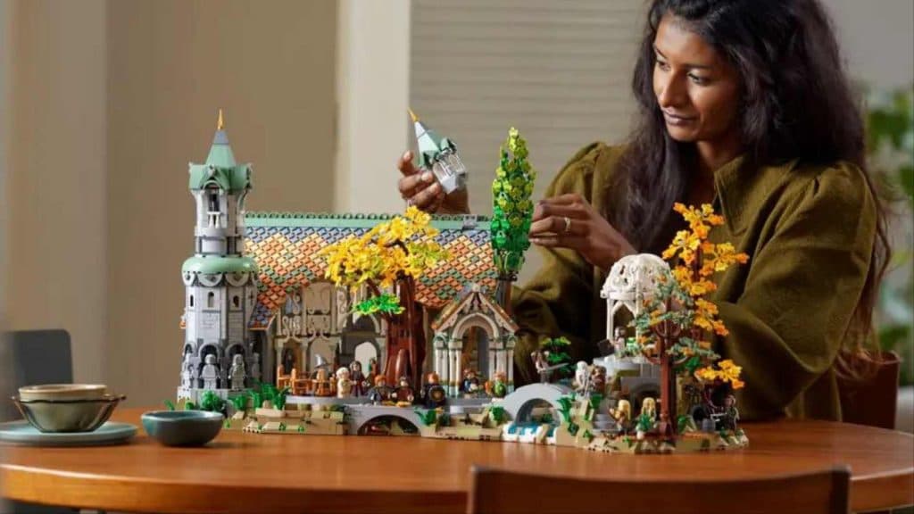 An adult with their LEGO The Lord of the Rings Rivendell set