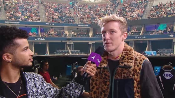 An image of Tfue taking part in an interview during a Fortnite tournament.