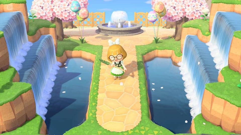 An image of a character standing on a walkway on either side of a waterfall 