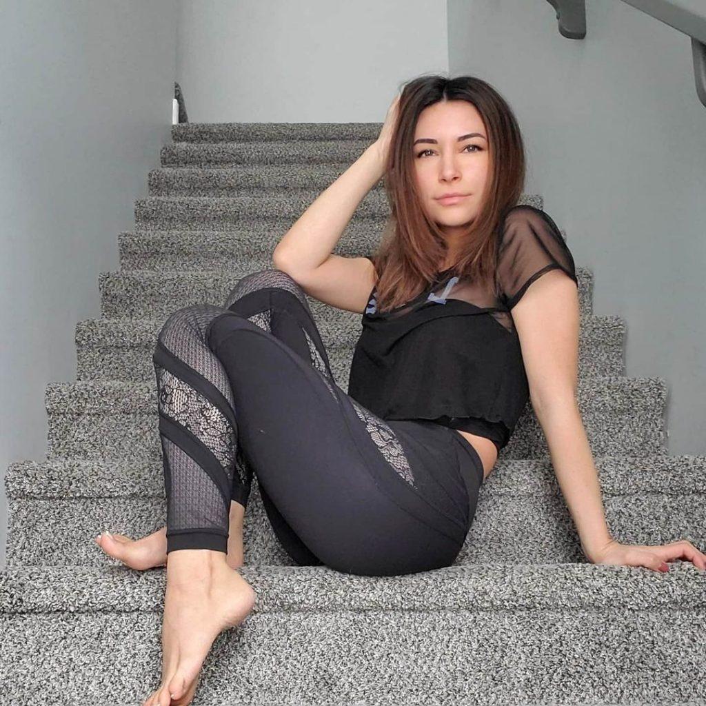 Alinity poses on stairs
