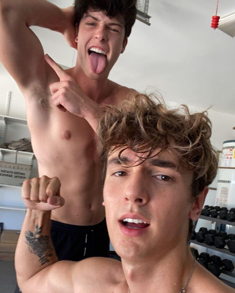 Bryce Hall and Blake Gray flex while in the midst of a gym session.