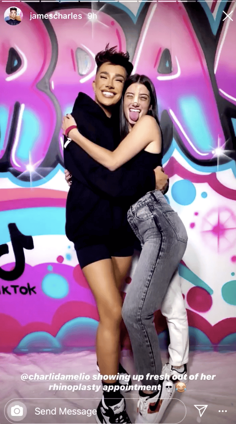James Charles and Charli D'Amelio embrace amid a colorful background.
