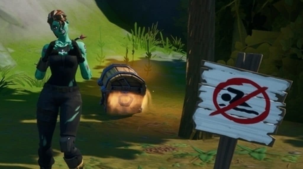Fortite character standing beside a No Swimming sign. 