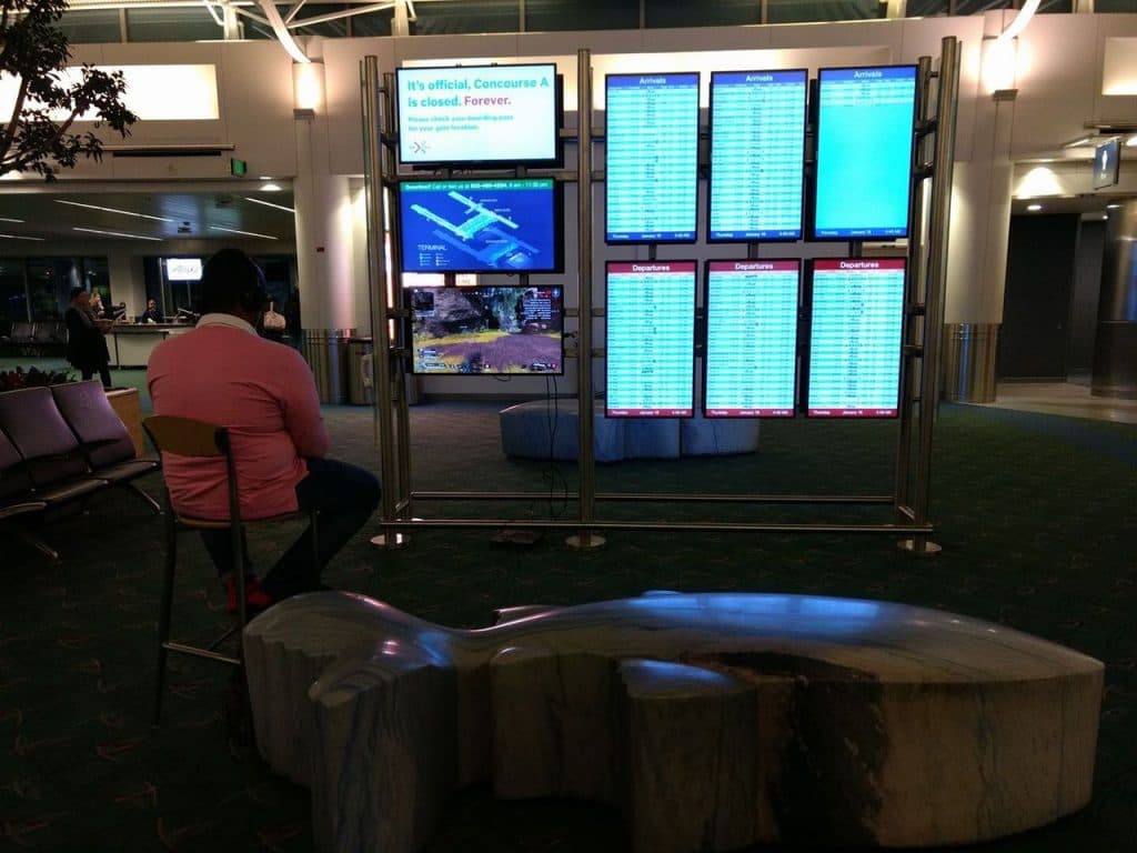 Man plays Apex Legends at airport