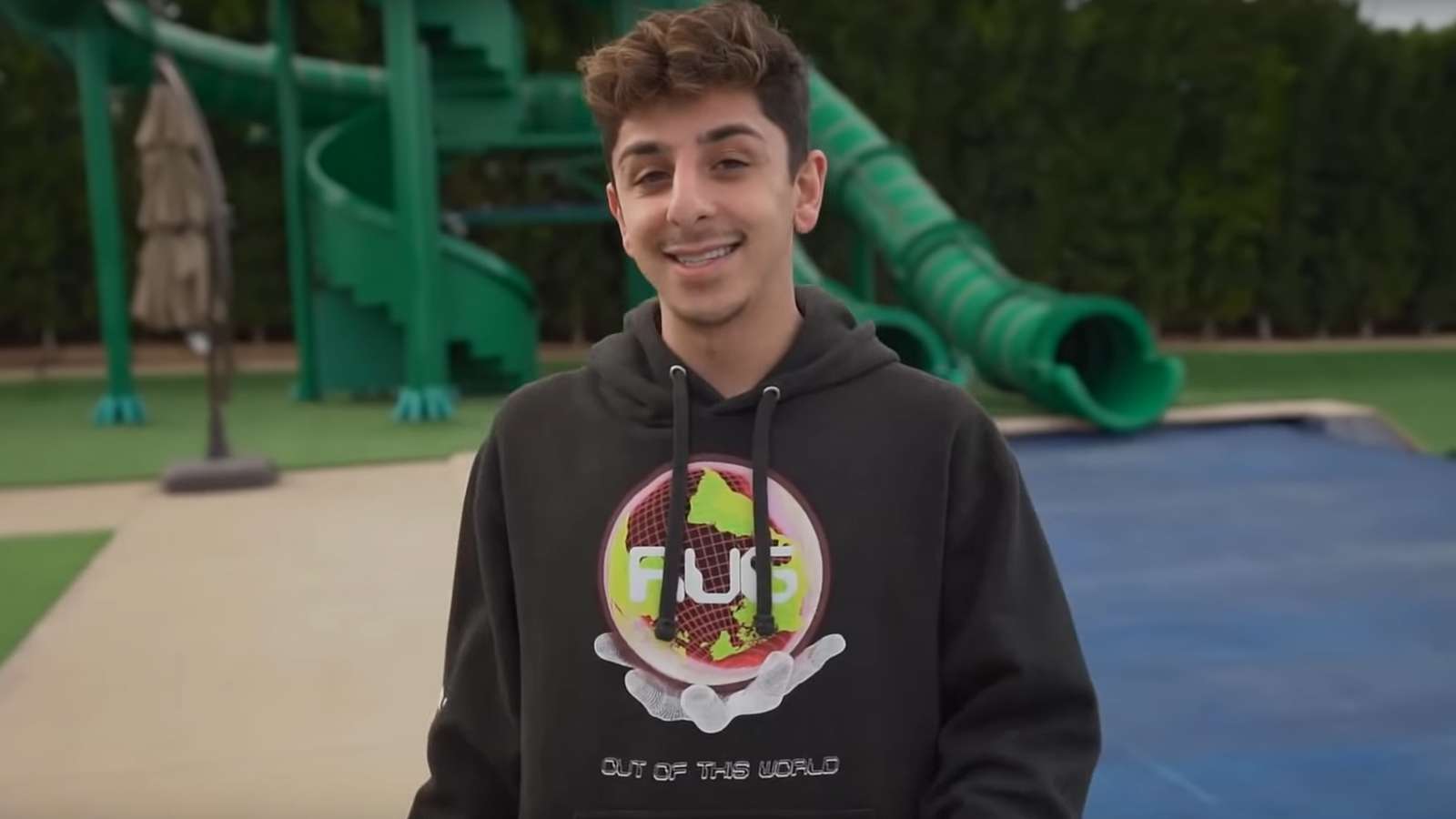 FaZe Rug filming in front of the water slides.