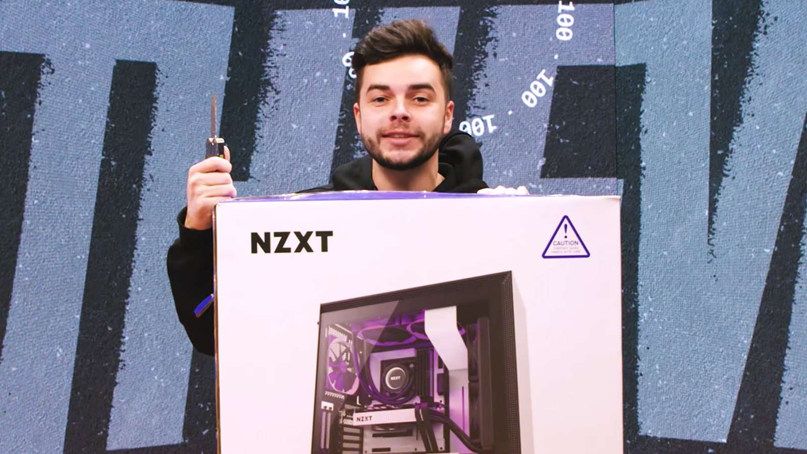 Nadeshot standing with PC box about to unbox it