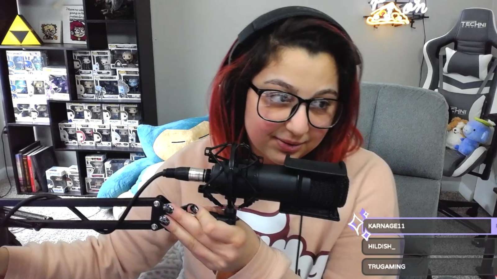 Streamer holding microphone stand on Twitch