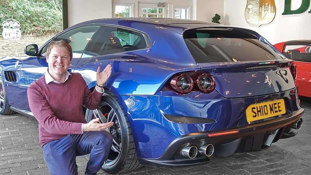 An image of a man with a blue ferrari gt4 lusso
