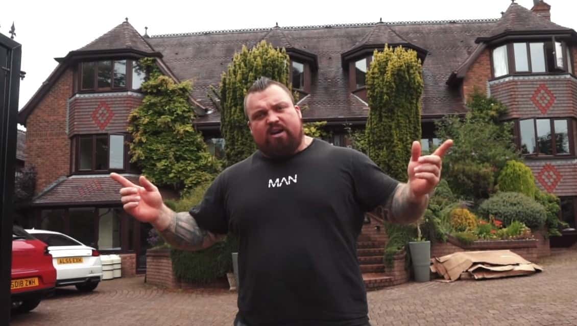 Eddie Hall standing outside his house.