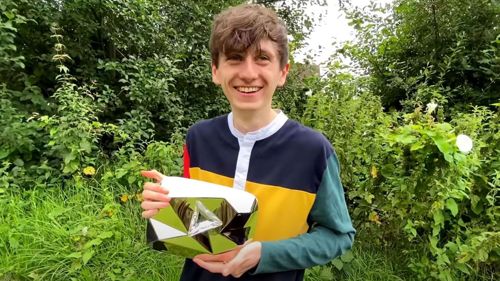 youtuber holding play button