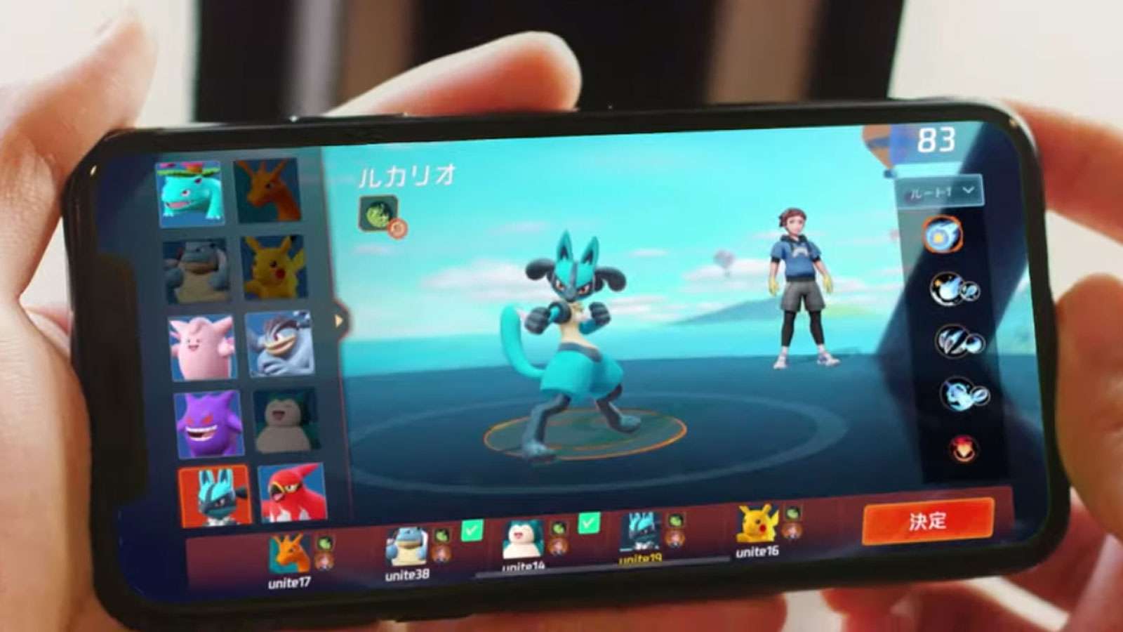 person playing pokemon unite phone
