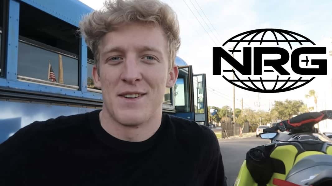 Tfue standing next to a real life battle bus with the NRG logo