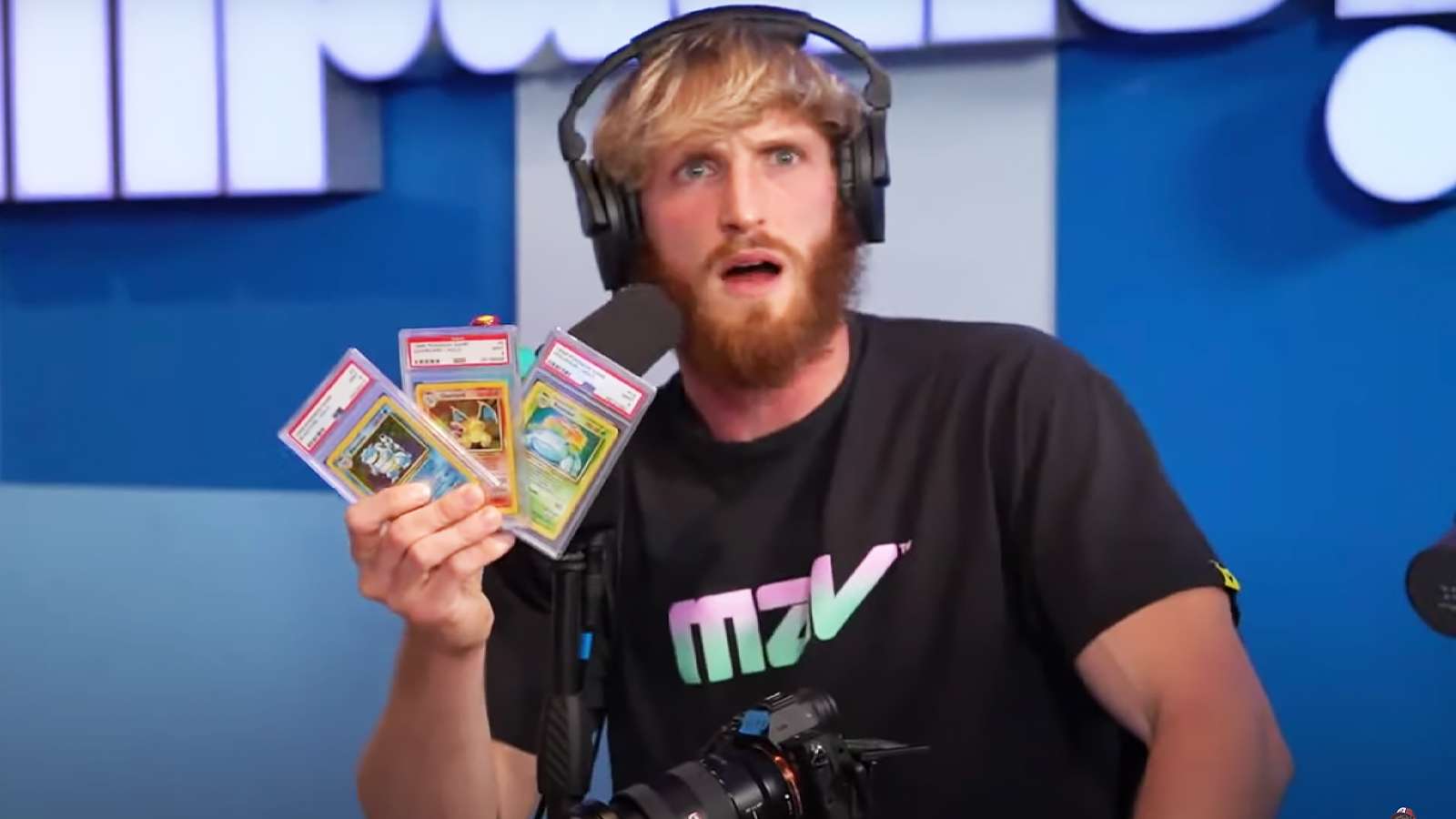 logan paul holding pokemon cards