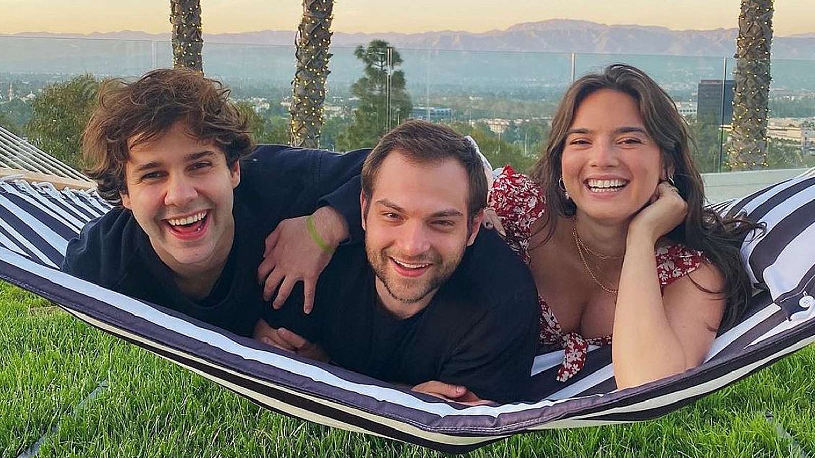 David Dobrik, Natalie, and Ilya pose on a hammock in Los Angeles.