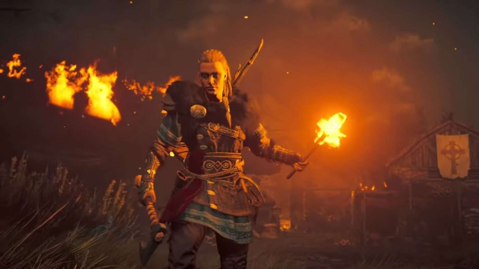 Eivor in a burning village in Assassin's Creed Valhalla