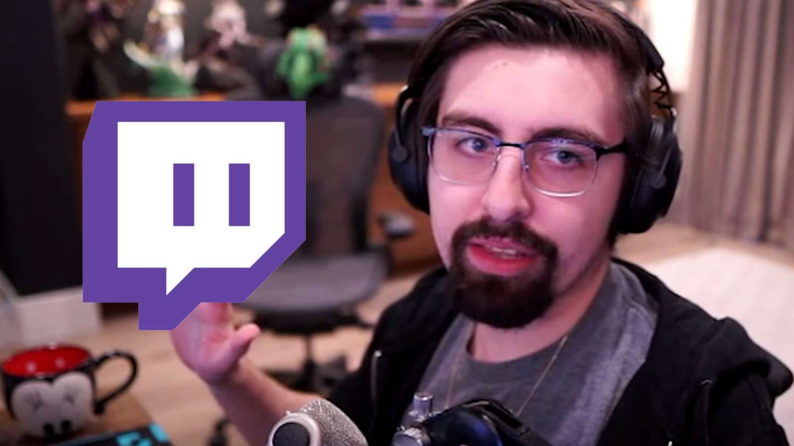 Shroud faces the camera next to the Twitch logo