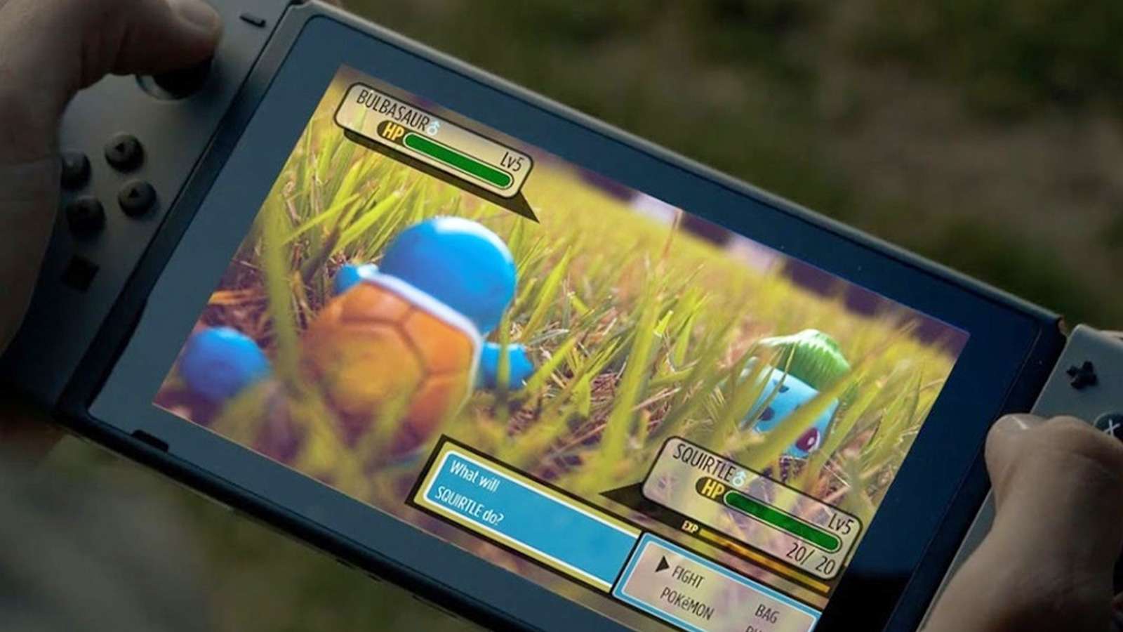 Screenshot of someone holding Nintendo Switch playing Pokemon.