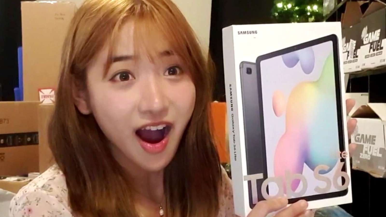 Twitch streamer Jinny showing the camera what a fan gifted her