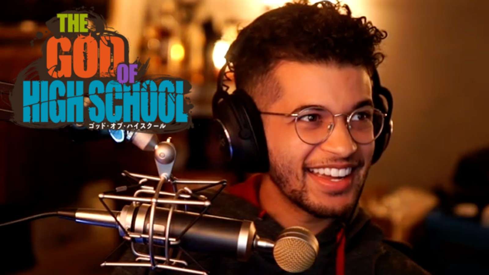 Jordan Fisher while streaming next to the God of High School logo