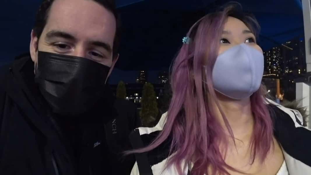 Twitch streamers looking at a camera with masks on
