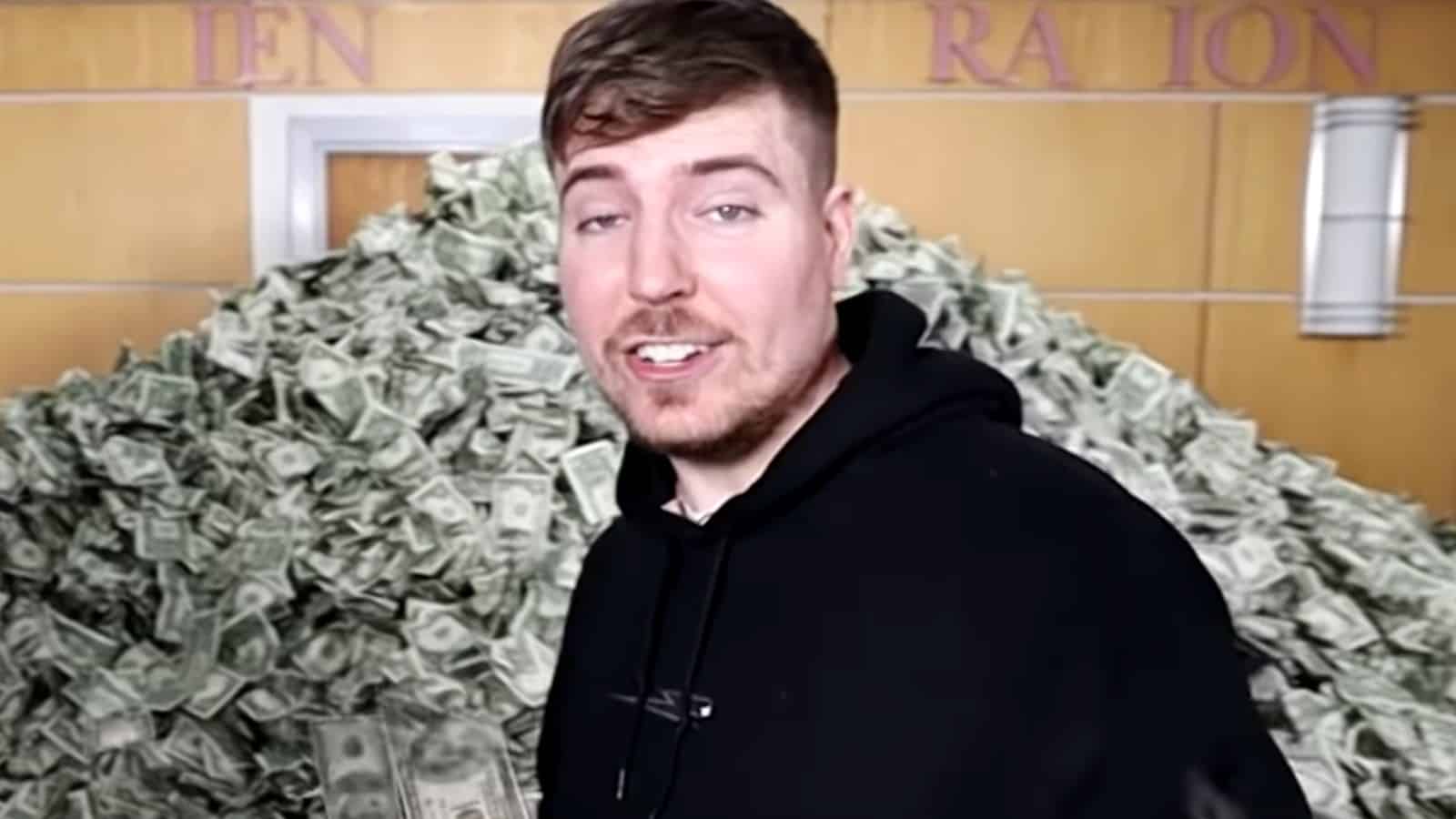 MrBeast standing in front of a pile of money