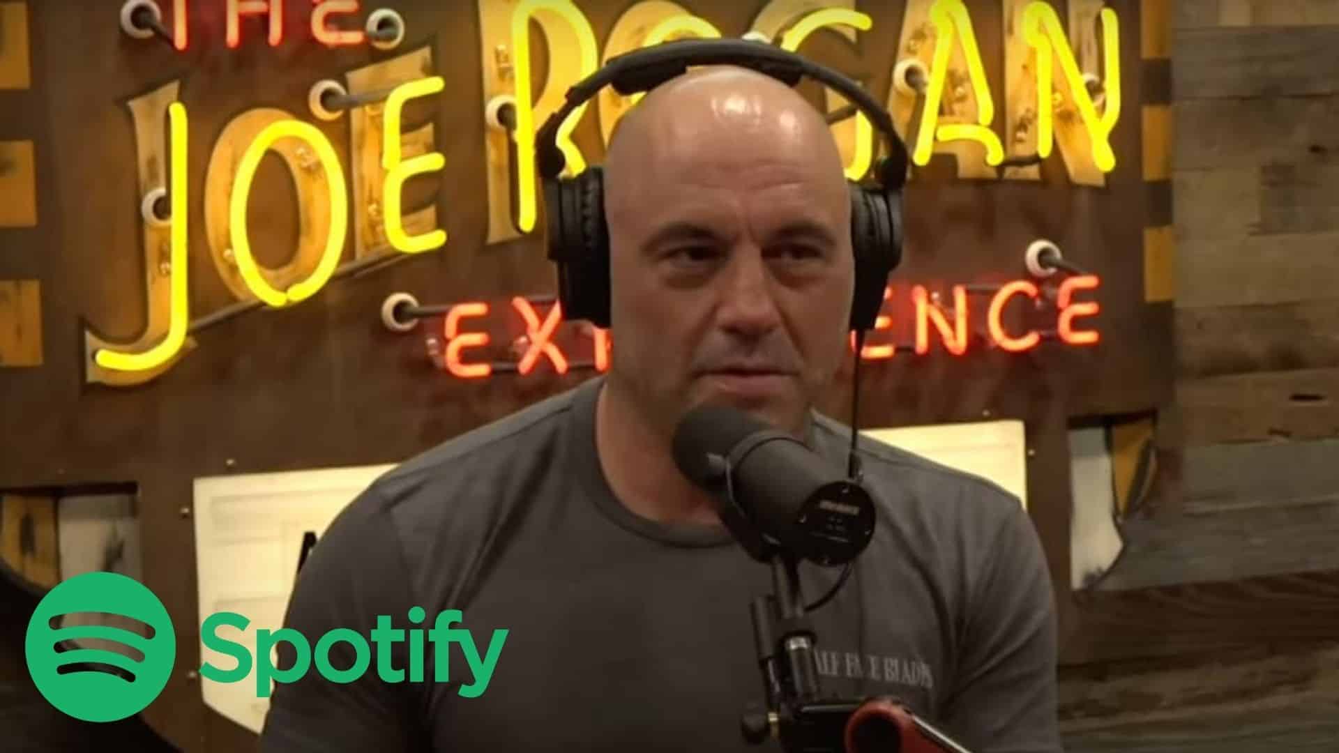 Joe Rogan hosting JRE Podcast with Spotify logo
