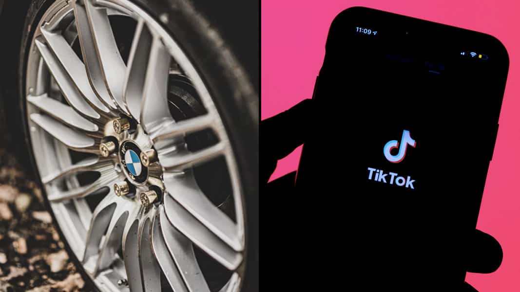 Close up of BMW car wheel in the rain alongside pink showing with TikTok logo
