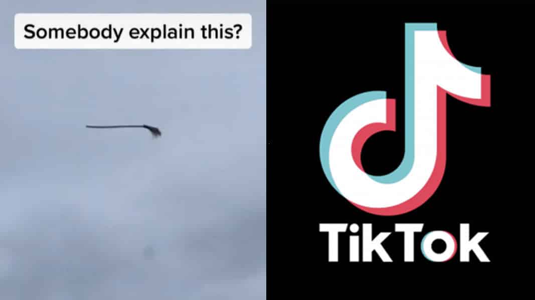 Floating broom against a sky background with TikTok logo