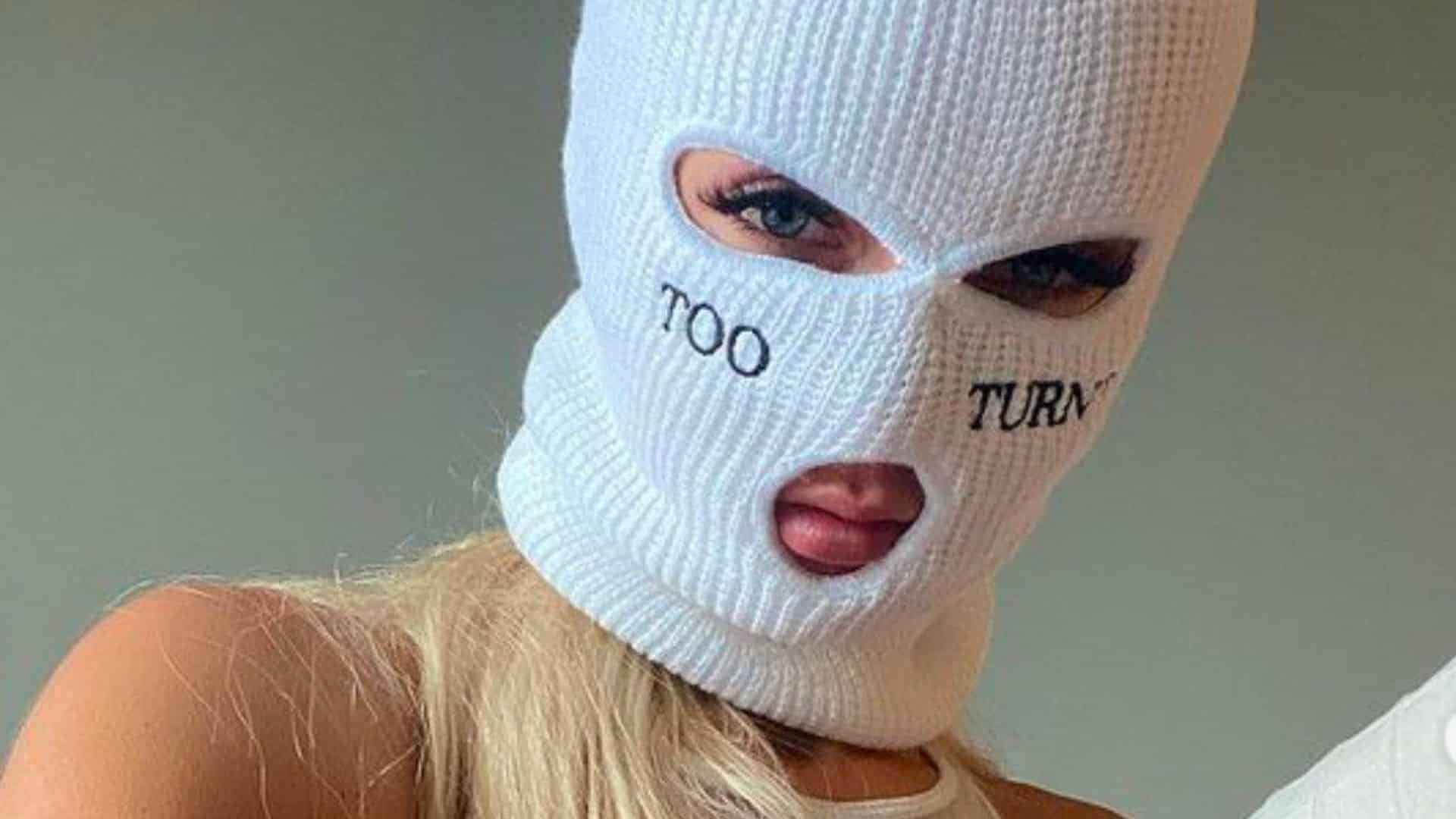 SkiMaskGirl wearing white ski mask with too turnt wording
