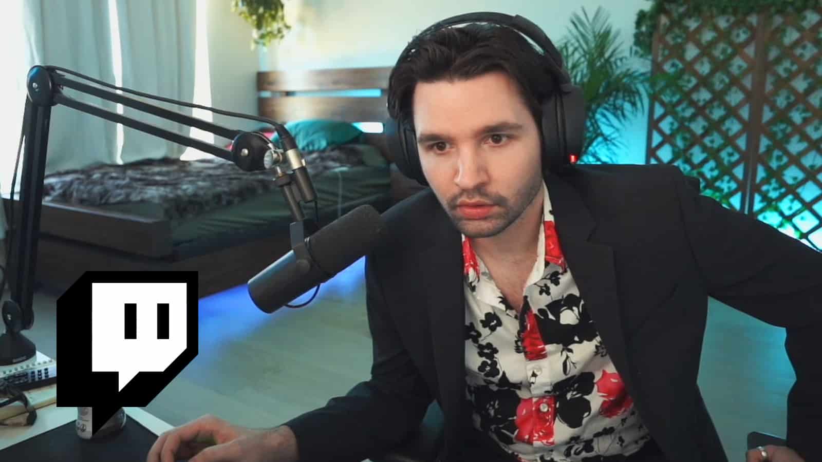 Cyr wearing blazer and floral shirt on Twitch stream