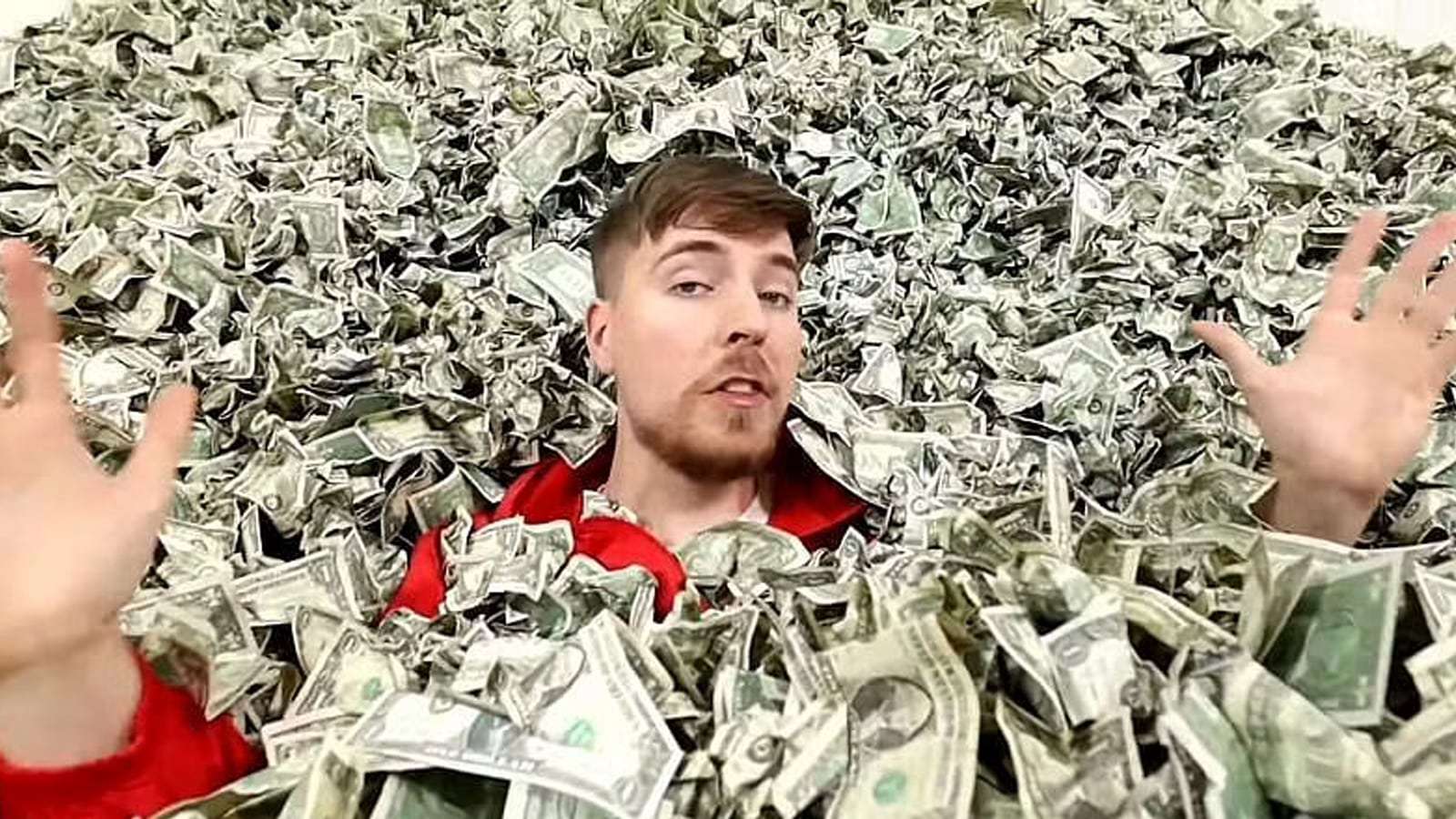 Mr Beast sat in a pile of money.