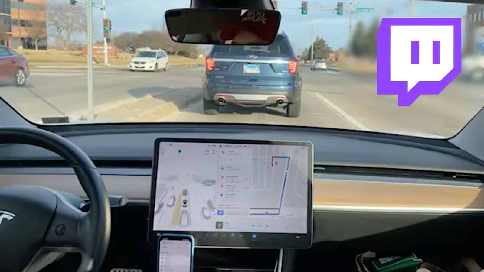 Twitch streamer driving Tesla with Twitch logo in corner