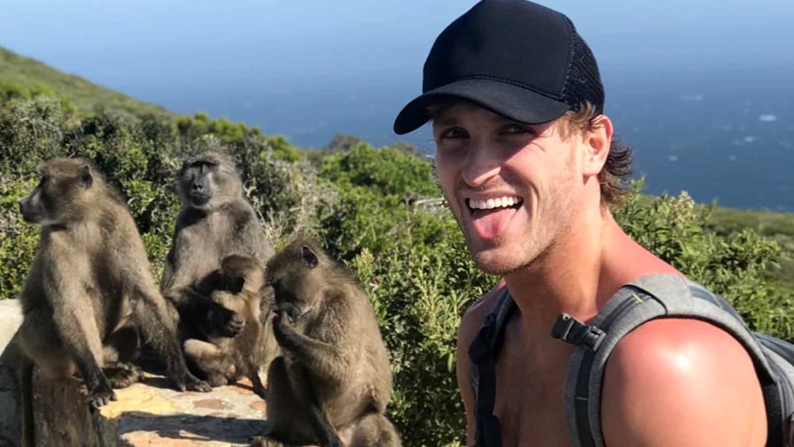 Logan Paul next to some monkeys