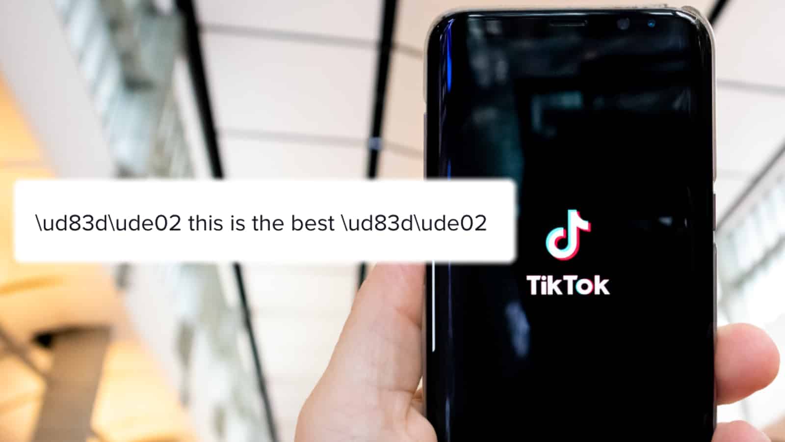Hand holding phone next to screenshot of TikTok glitch