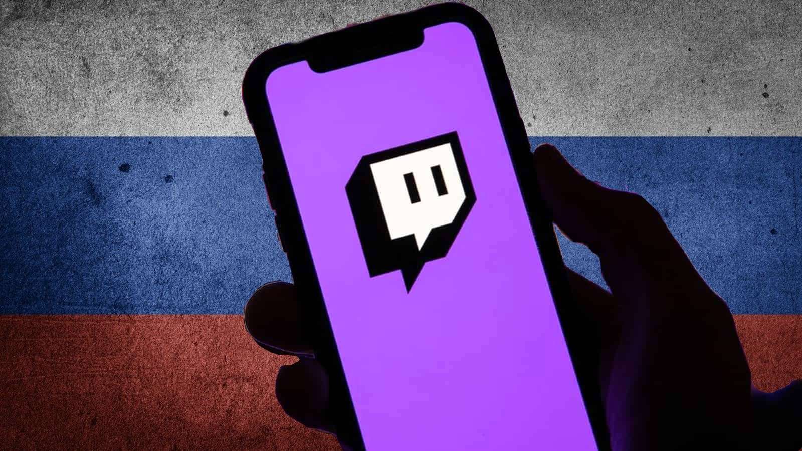 Hand holding Twitch app on top of Russian flag