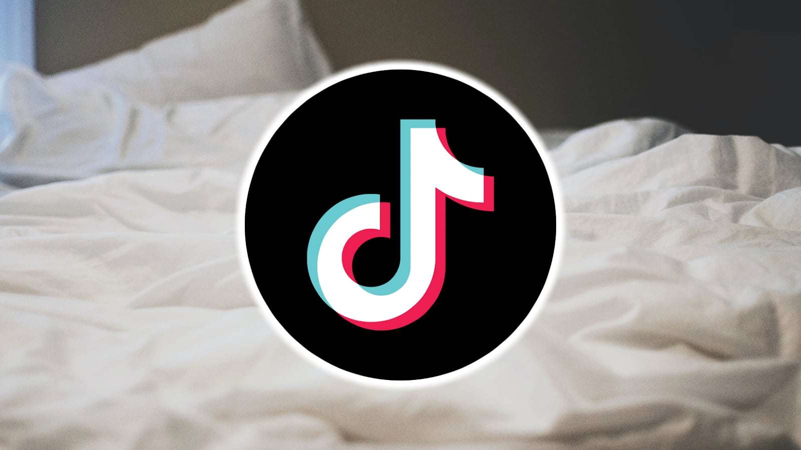 TikTok logo over bed sheets