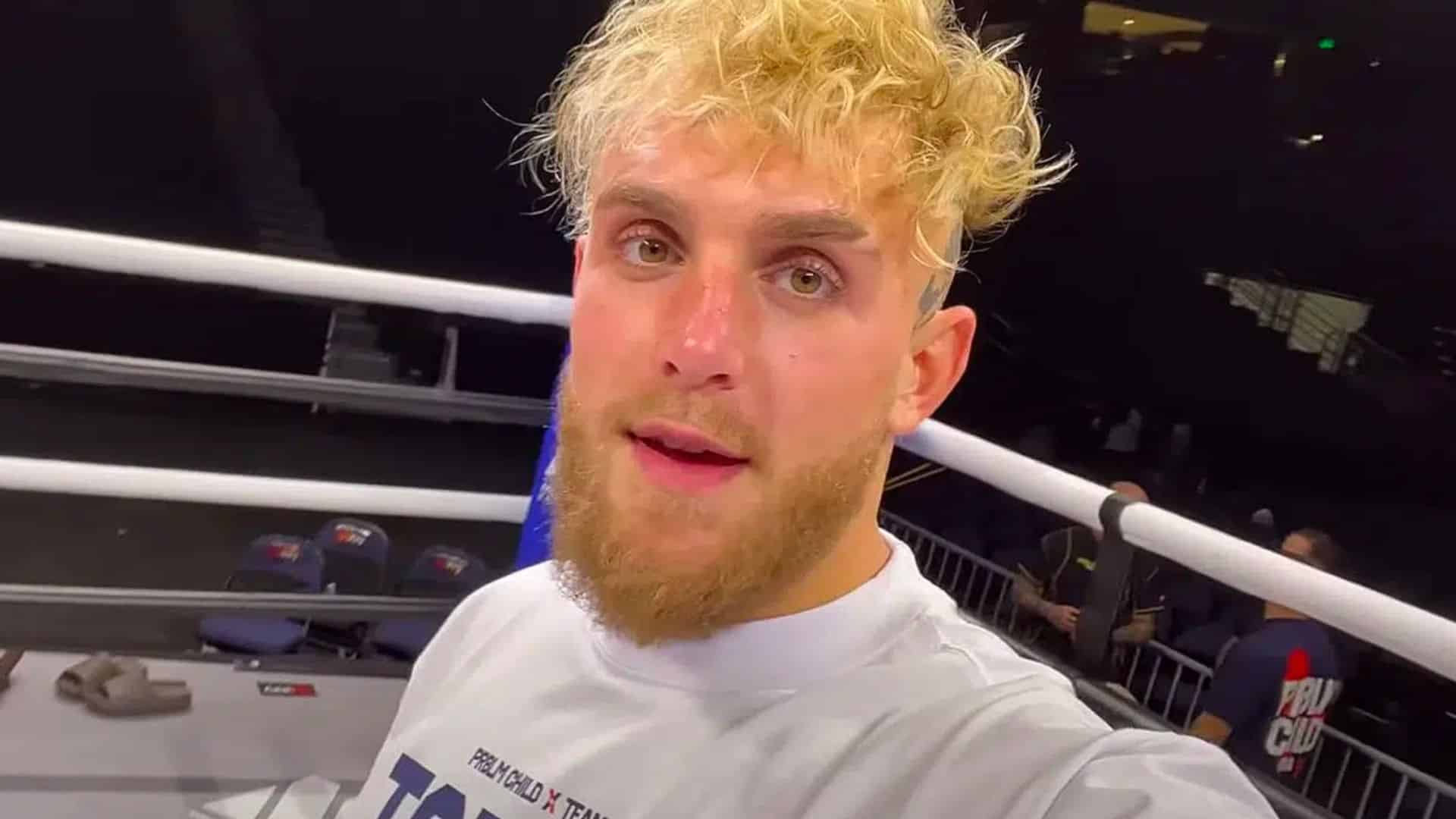 Jake Paul stood inside boxing ring talking to camera