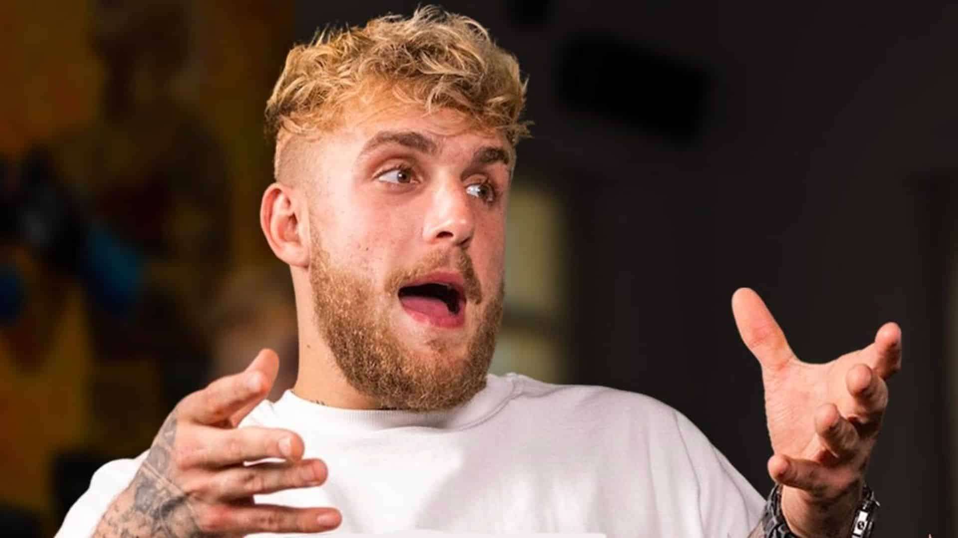 Jake Paul talking to camera with hands raised