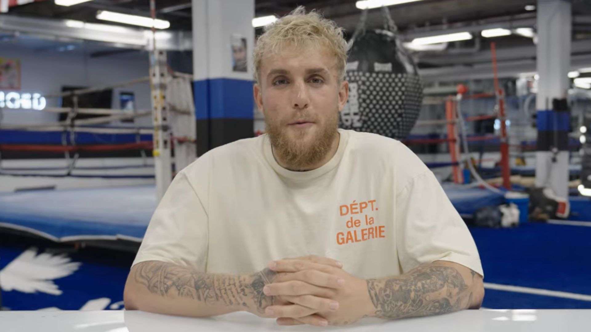 Jake Paul talking to camera in boxing gym