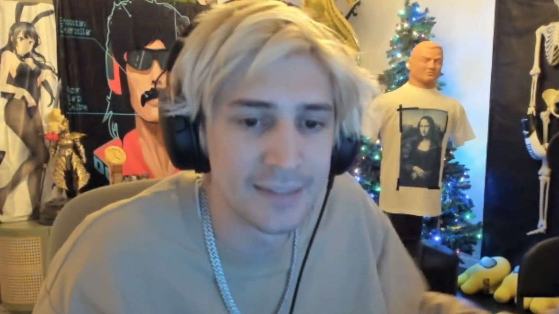 xQc talking to camera with dr disrespect blanket and dummy in background