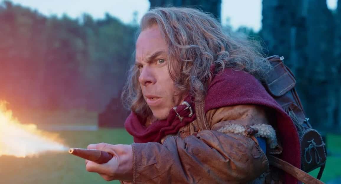 Warwick Davis fires a flame-thrower in Willow.