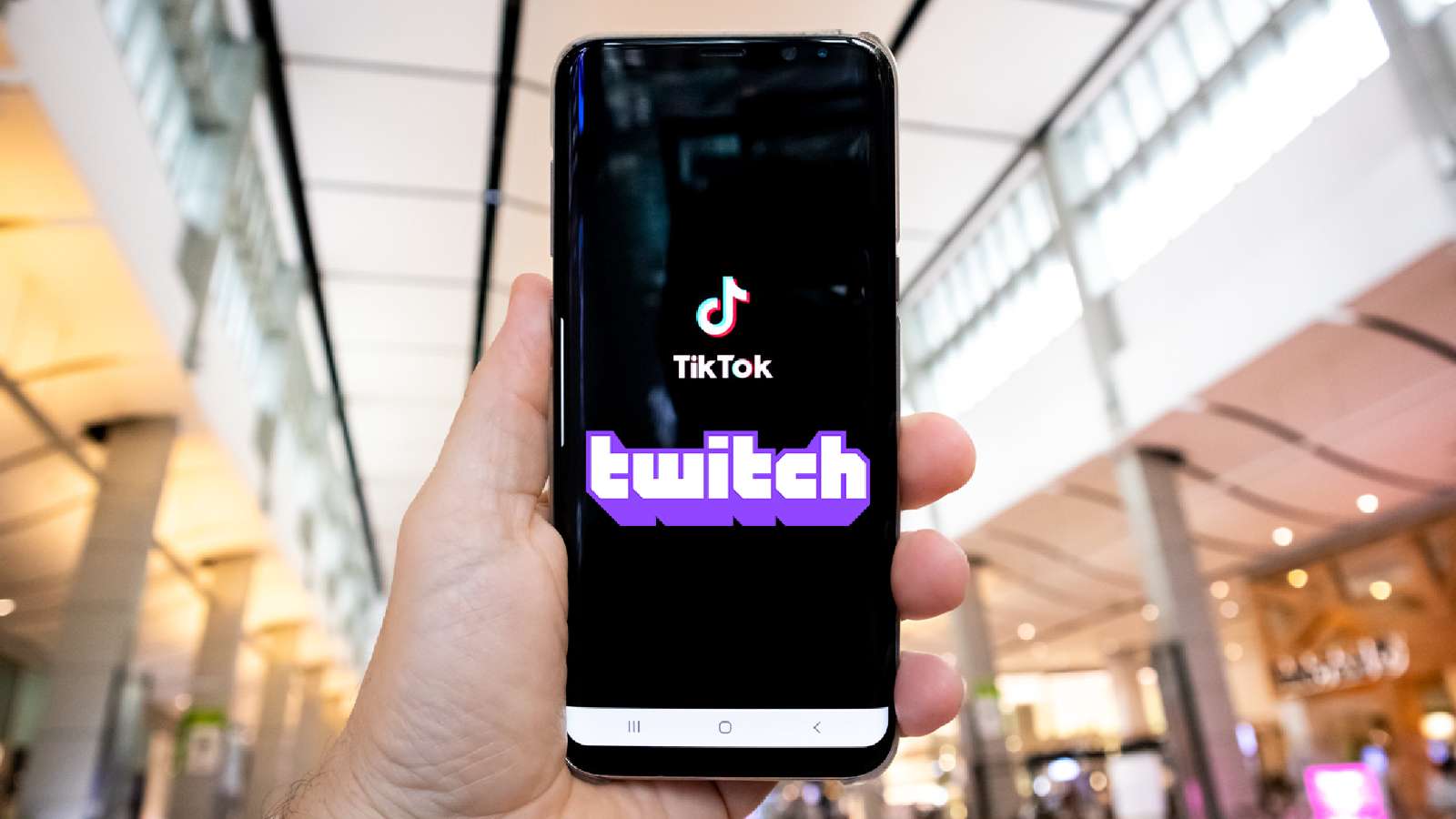 tiktok and twitch logos on phone