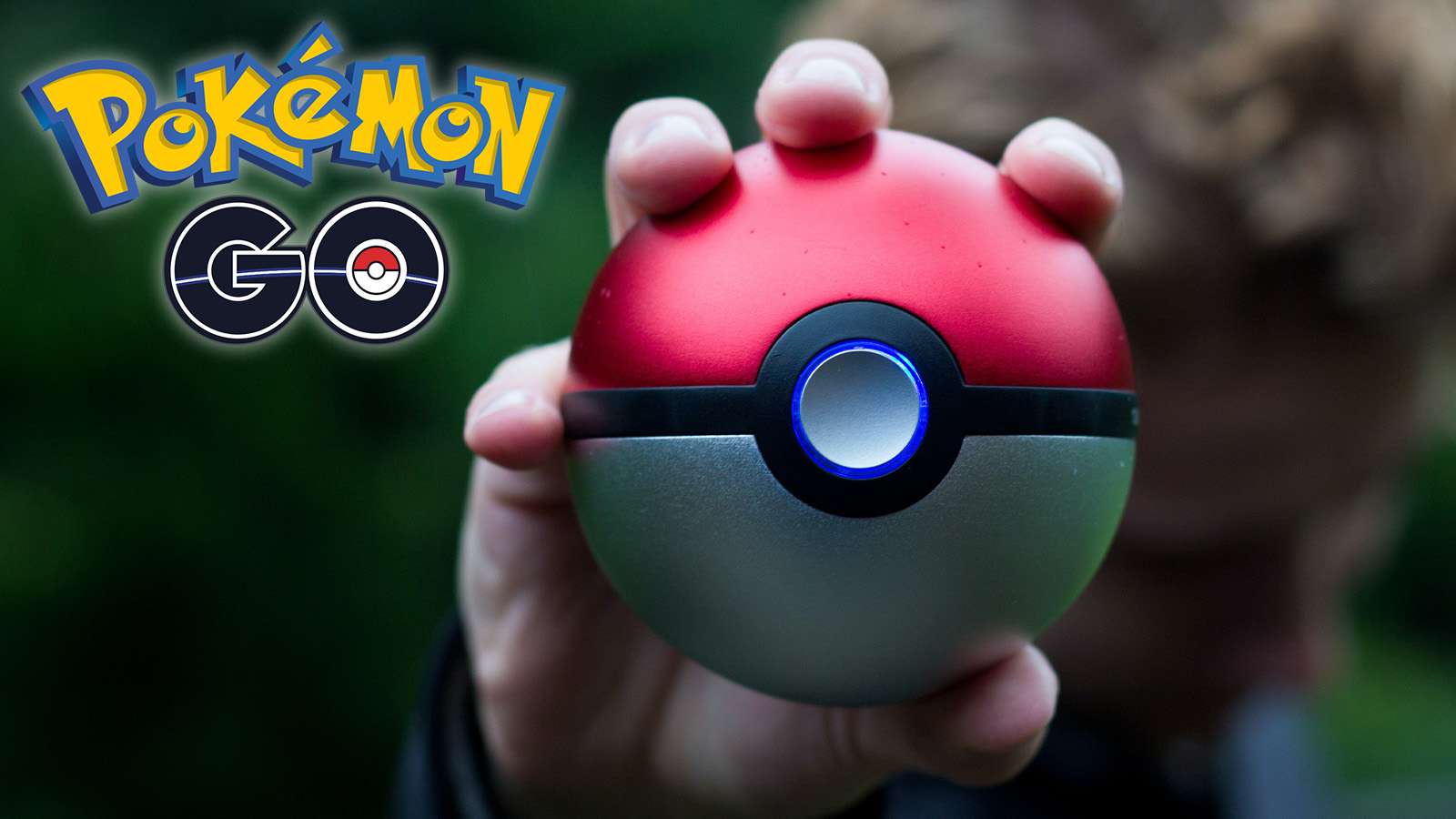 Pokemon fan holding a pokeball towards camera