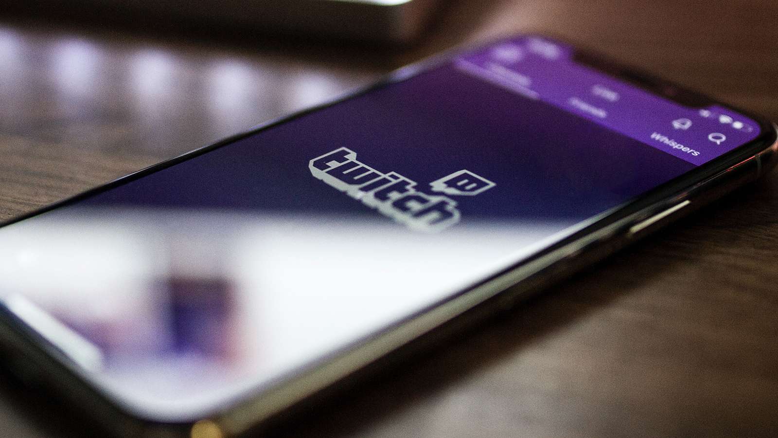 The Twitch app is shown on a smart phone.