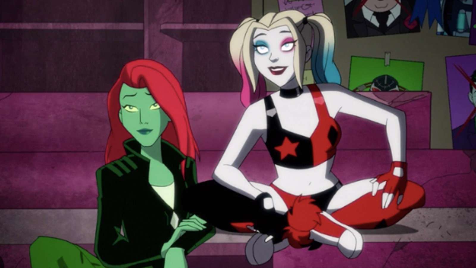 Harley Quinn and Poison Ivy sit side by side