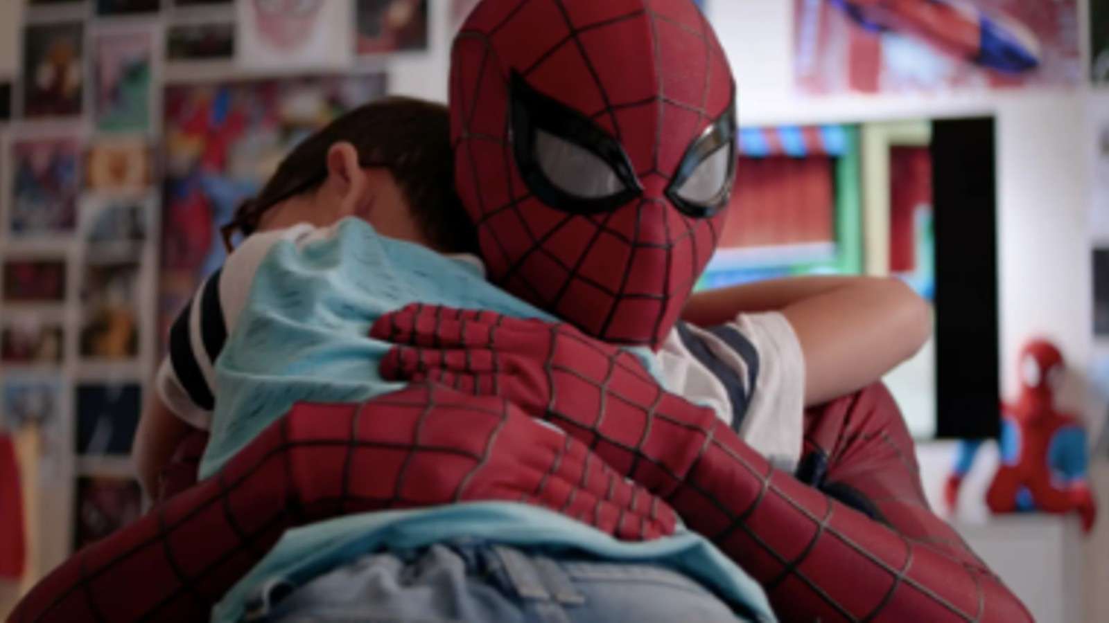 Spider-Man hugs a child in Spider-Man: Lotus