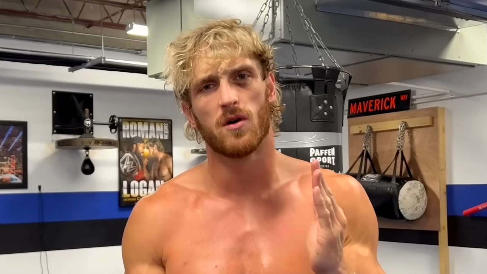 Logan Paul staring into camera in his gym