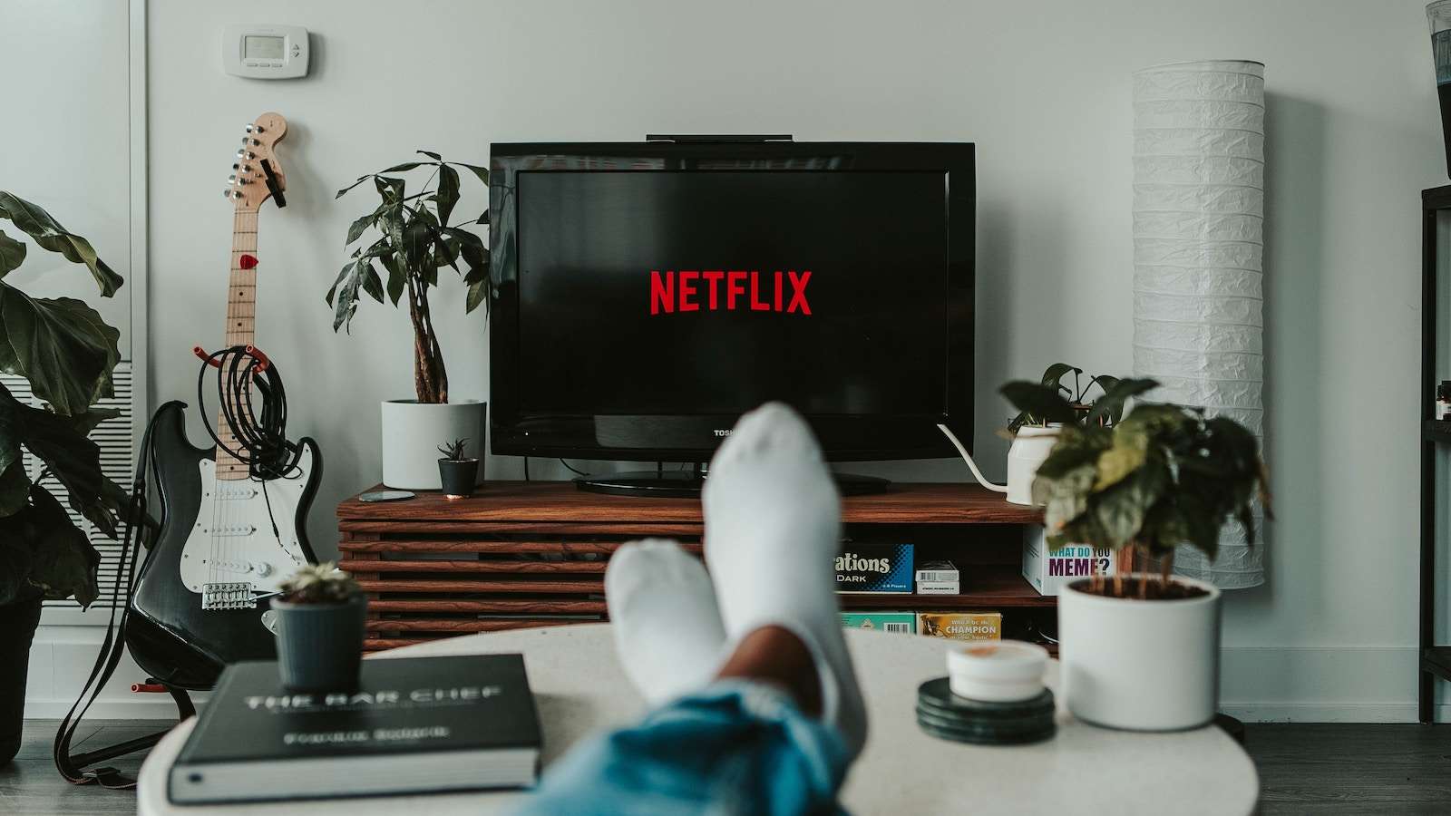 Stock image of man watching Netflix