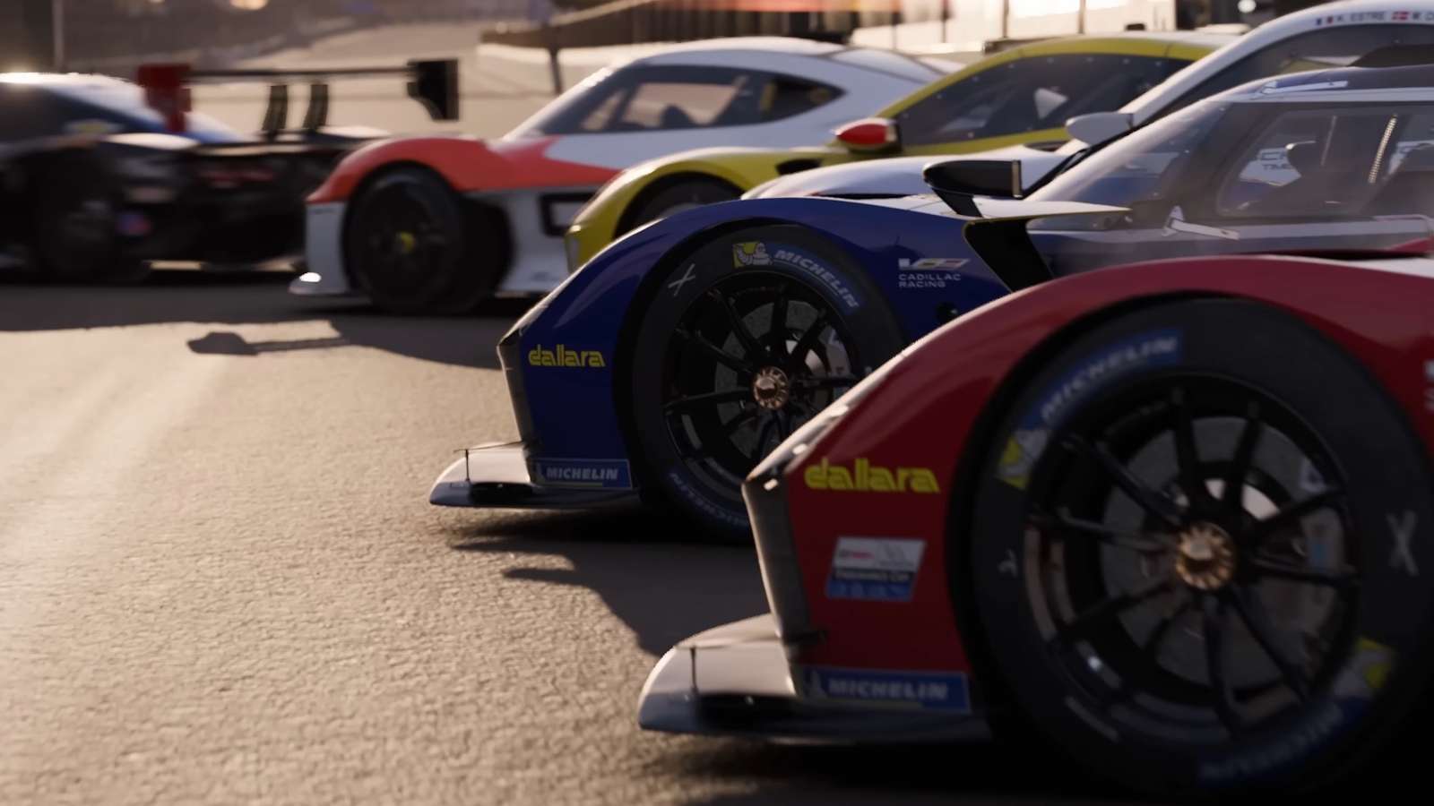 Several GT race cars pulling of of pits in Forza Motorsport.