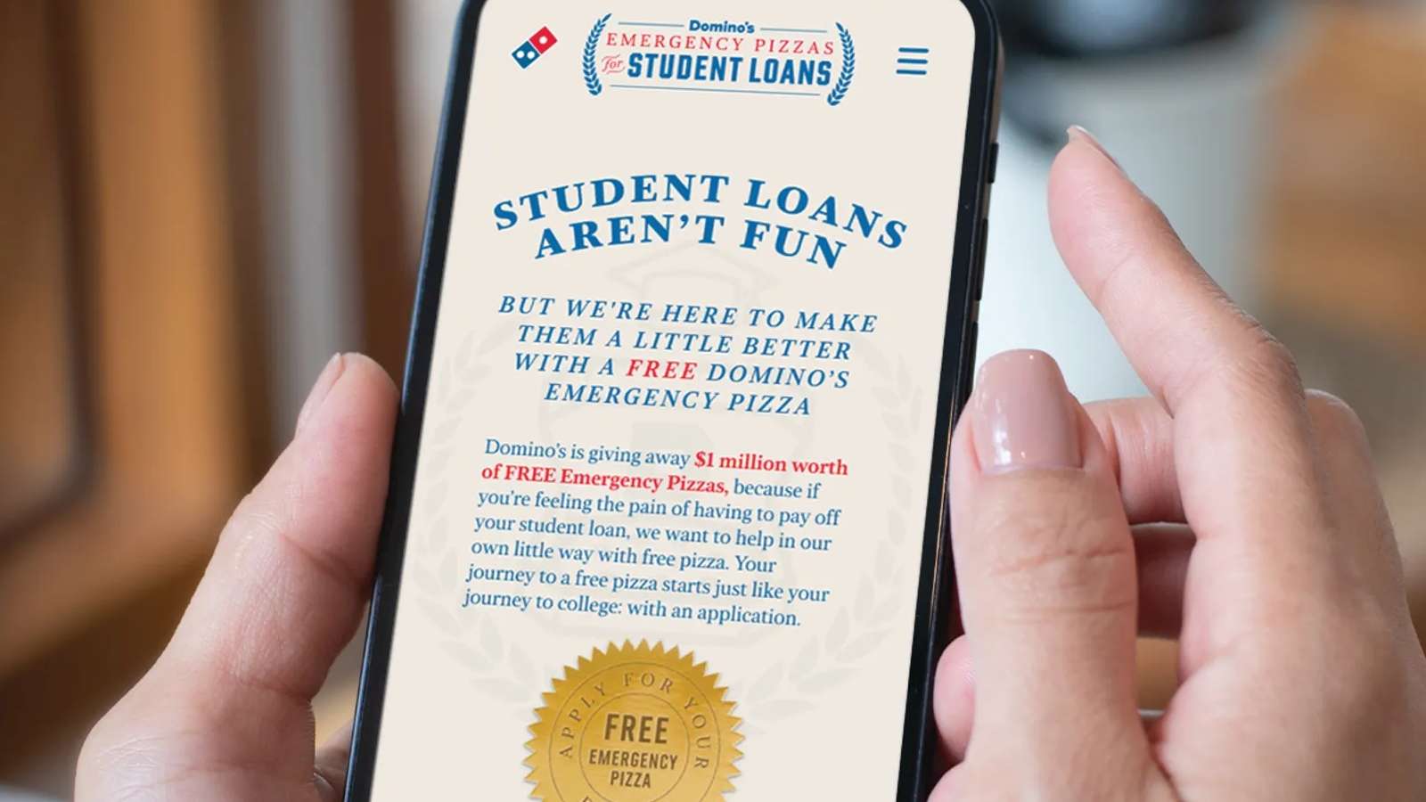 Image shows Domino's app, which features a free pizza deal for those with student loans
